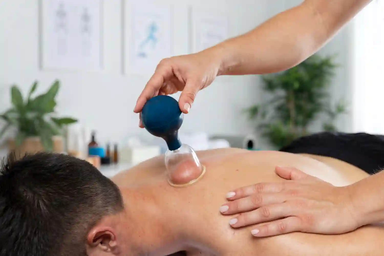 Professional therapist providing a focused deep tissue massage