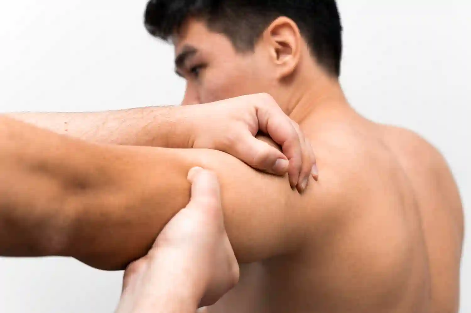 Deep tissue massage focused on tense shoulder muscles